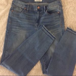Madewell size 29 skinny jeans with knee slits.